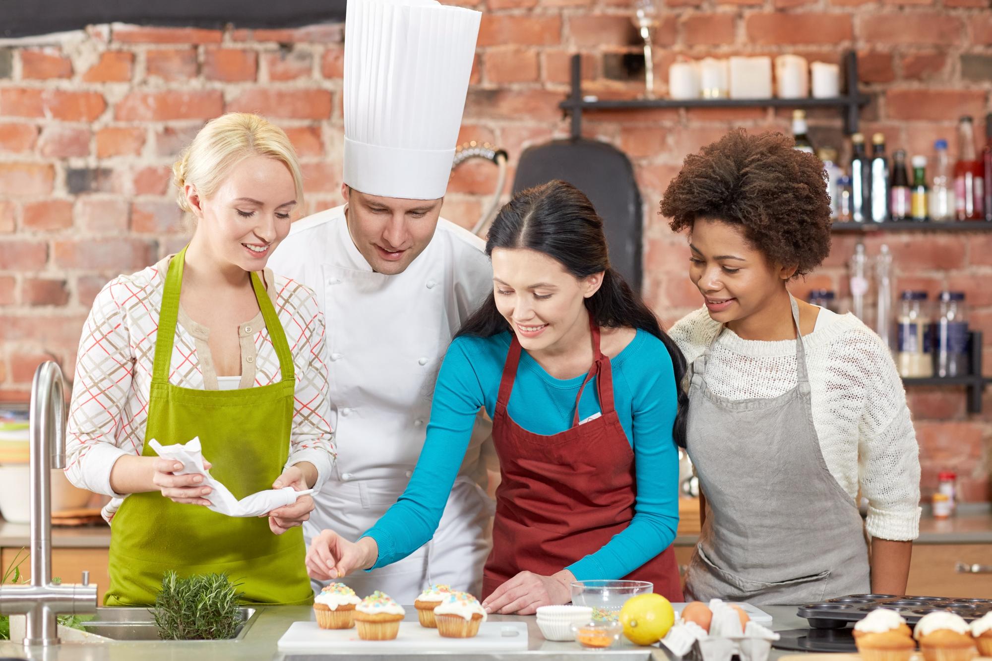 Students working at benches in studio kitchen